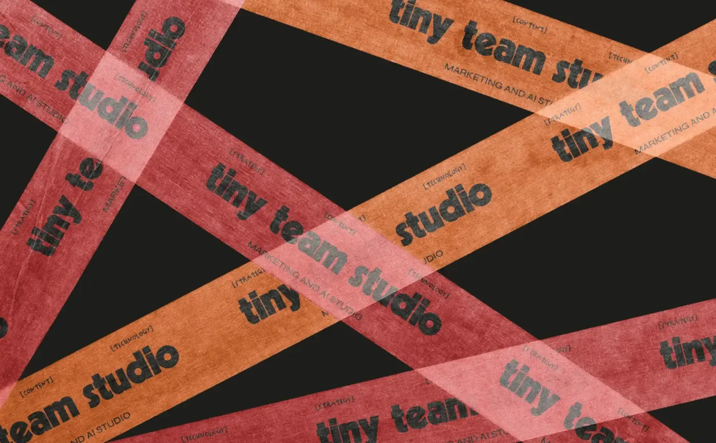 Printed packing tape criss-crossed over a black parcel, the wordmark repeating along it
